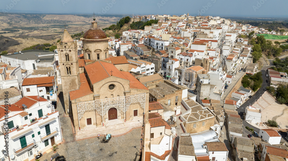 Aerial view of the church of Saints Peter and Paul in the historic center of Pisticci, in the province of Matera, Basilicata. It is a small town in southern Italy. Aerial view of the church of Saints Peter and Paul in the historic center of Pisticci, in the province of Matera, Basilicata. It is a small town in southern Italy.