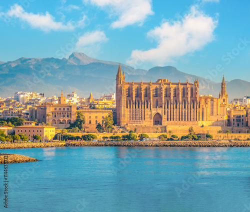 View the iconic gothic cathedral (la seu) and old town of  Palma de Mallorca with mountains of the interior in from the sea with the mountains of the interior in the background, Balearic Islands, Spai