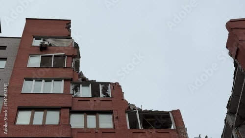 Russian missile hits residential building in Dnipro, Ukraine. Aftermath of enemy attack on city. Destroyed residential multi-story building. Close-up. War. Aftermath of explosion.