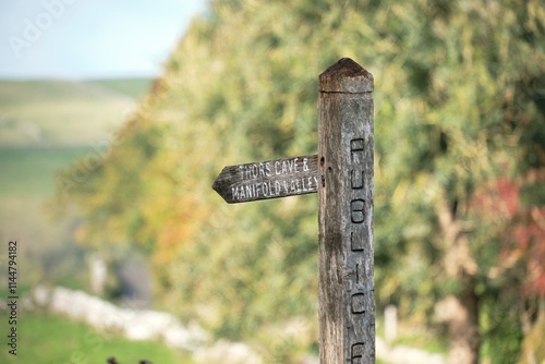 Wooden countryside footpath sign post in Wetton, Staffordshire, UK photo