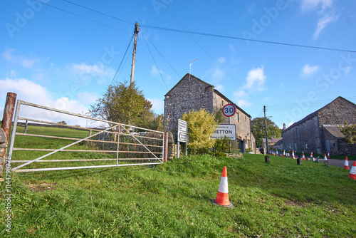 Village sign post in Wetton, Staffordshire, UK photo