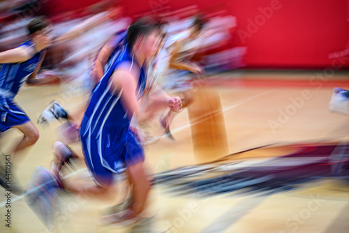 High School Basketball with motion blur showing the speed and movement of the young boys playing the game at Oxford HS in Upstate NY photo