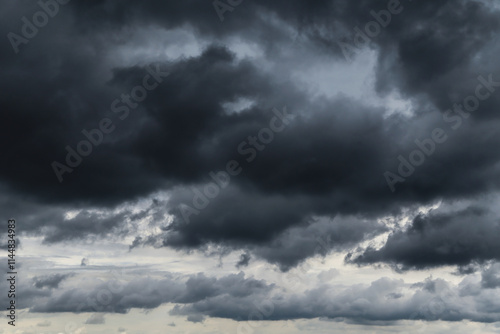 Epic Dramatic storm dark gray black cumulus rain clouds sky background texture, thunderstorm
