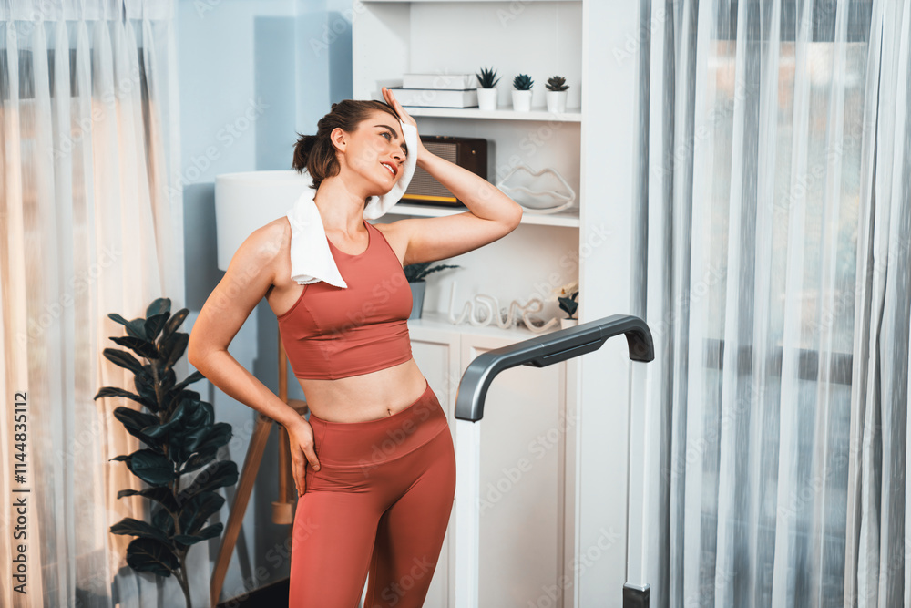Athletic and sporty woman running on treadmill running machine during home body workout exercise session for fit physique and healthy sport lifestyle at home. Gaiety home exercise workout training. Athletic and sporty woman running on treadmill running machine during home body workout exercise session for fit physique and healthy sport lifestyle at home. Gaiety home exercise workout training.