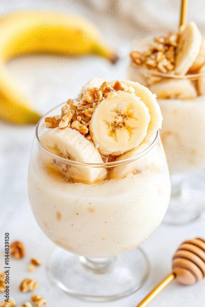 Delicious banana smoothie with nuts in a glass for a refreshing summer treat Delicious banana smoothie with nuts in a glass for a refreshing summer treat
