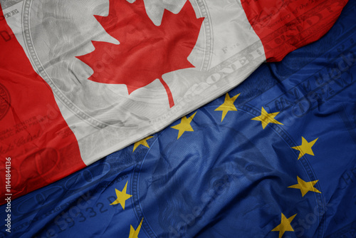 waving colorful flag of canada and national flag of european union on the dollar money background. finance concept.
