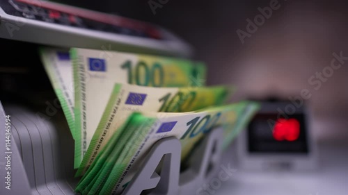 Wallpaper Mural New green hundred euro banknotes being counted in cash machine. Money counting machine with bills. Close up. Blurred backdrop. Torontodigital.ca