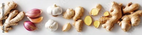 clean flat lay of garlic cloves and ginger root arranged neatly on white matte surface under diffused lighting photo