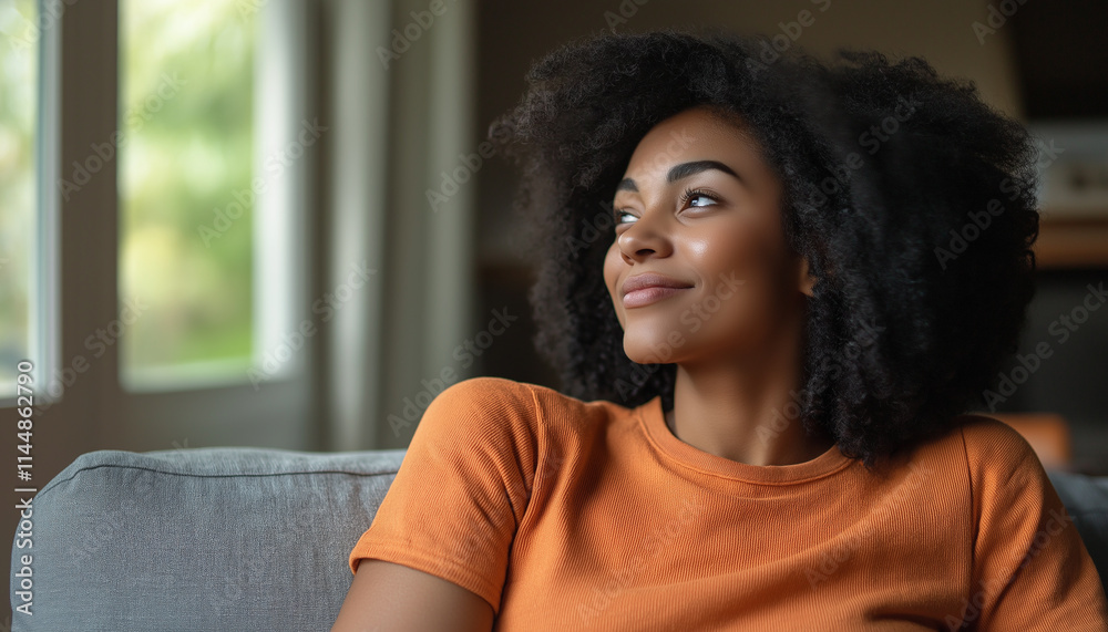 Fototapeta premium Peaceful Brazilian Woman Relaxing On Couch With Natural Light