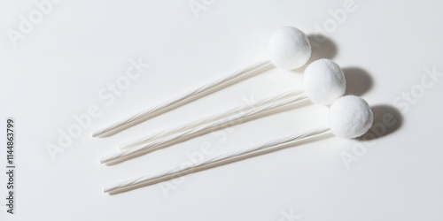 Ear cleaning tool for effective personal care of the ears. Cotton buds designed for makeup application and ear hygiene, displayed on a clean white background. Perfect for personal care routines. photo