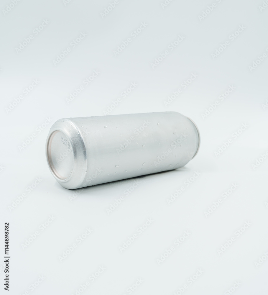 silver aluminum can with water droplets, lying on white surface silver aluminum can with water droplets, lying on white surface