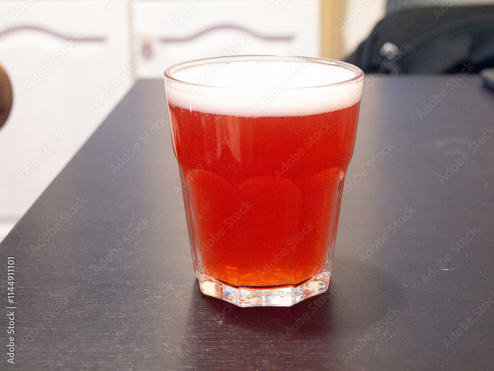 glass of fruit beer on table glass of fruit beer on table