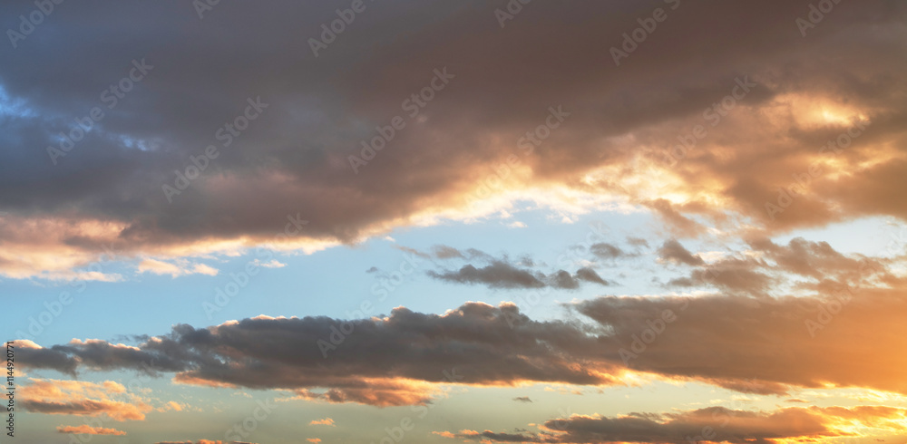 Sunset sky background. Beautiful bright sunset sky with clouds. Sunset sky background. Beautiful bright sunset sky with clouds.