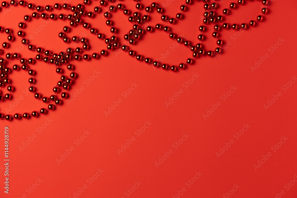 Universal red background with beads. Flat lay, top view. Universal red background with beads. Flat lay, top view.