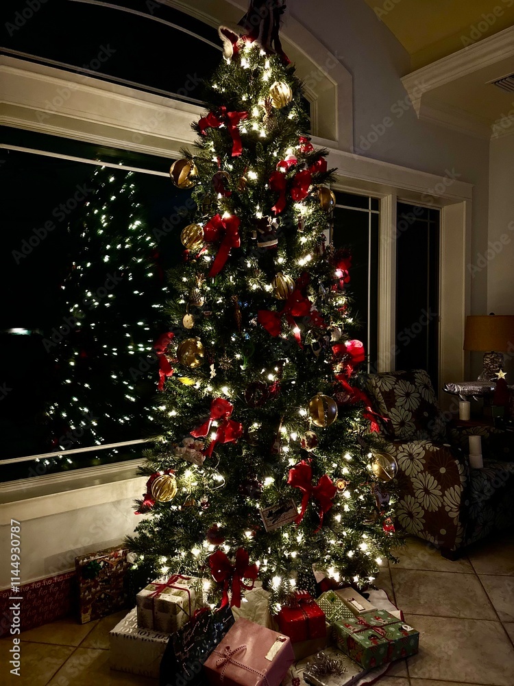 Golf and red Lighted Christmas tree at night Golf and red Lighted Christmas tree at night