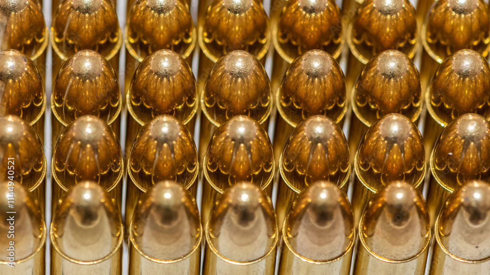 photo of a black pistol and bullets on a black background photo of a black pistol and bullets on a black background