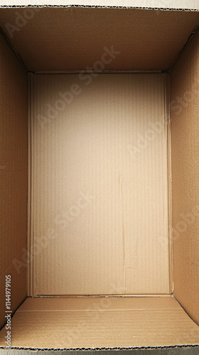 Top-Down View of an Empty Corrugated Cardboard Box with Clean Surfaces for Packaging, Shipping, or Storage photo