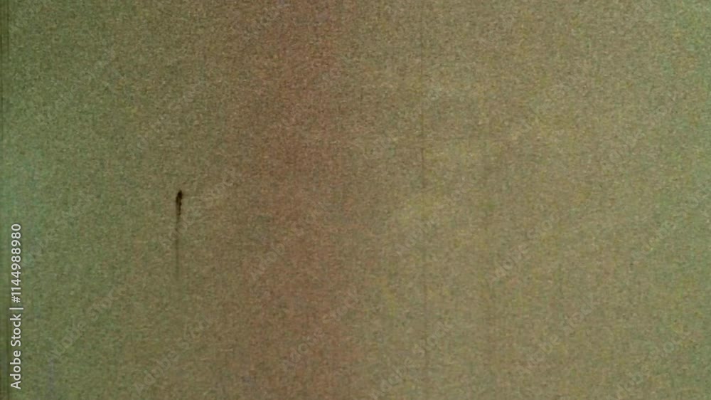 Looped noisy, grainy background beige film archive. Aged backdrop natural orange with scratches. Seamless loop old archival video. Dirty grunge overlay noise in retro abstract video. Vintage texture