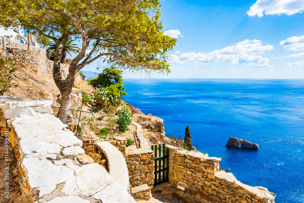 Walking path along sea and high cliffs to Panagia Hozoviotissa monastery, Amorgos island, Cyclades, Greece
