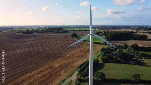 Aerial drone footage of wind turbine in rural landscape in Northern Germany