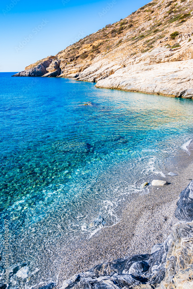 View of Mouros bay and beach with crystal clear azure sea water, Amorgos island, Cyclades, Greece