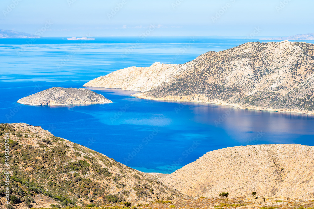 View of Nikouria island, sea and mountains, Amorgos island, Cyclades, Greece