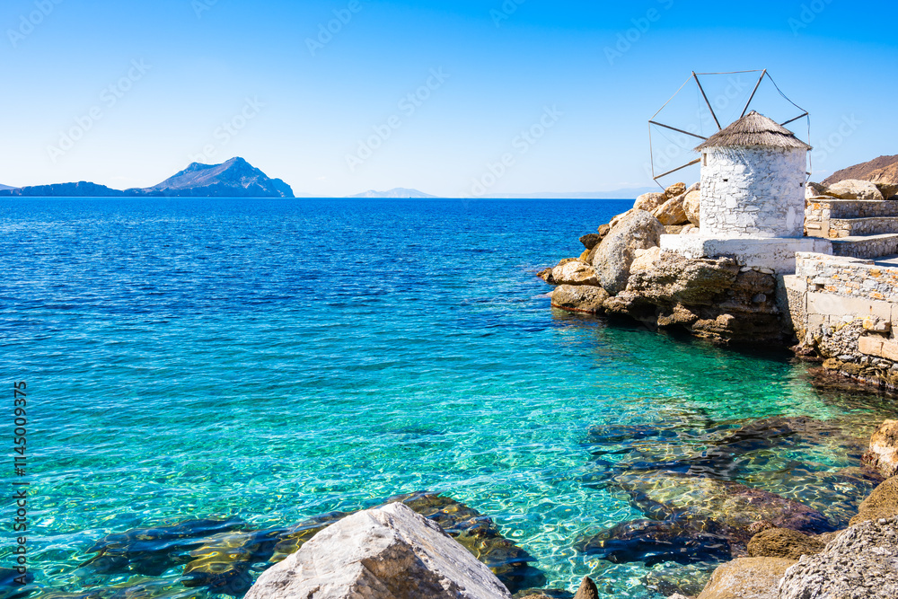 Windmill in port of Aigiali (Ormos Egialis), Amorgos island, Cyclades, Greece