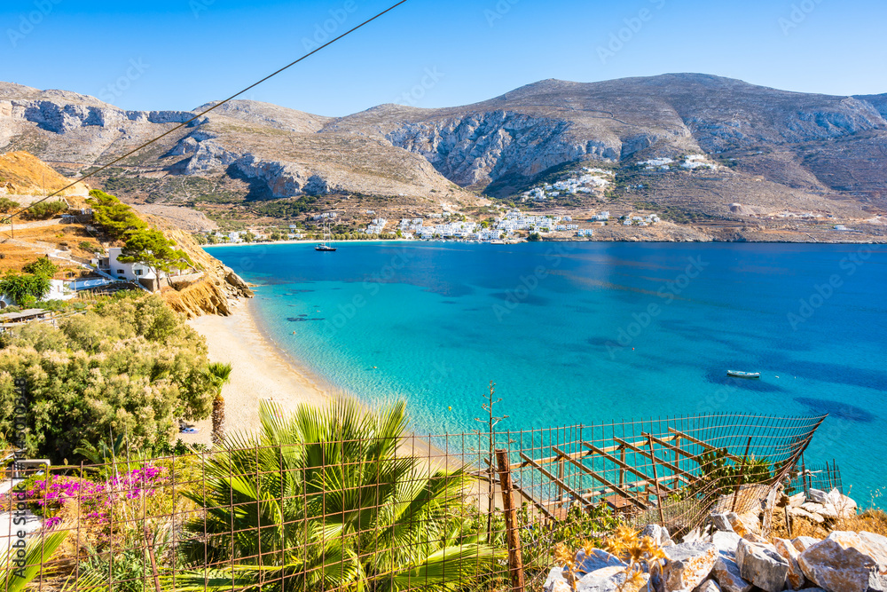 View of idyllic sandy Levrossos beach in Aigiali bay (Ormos Egialis)