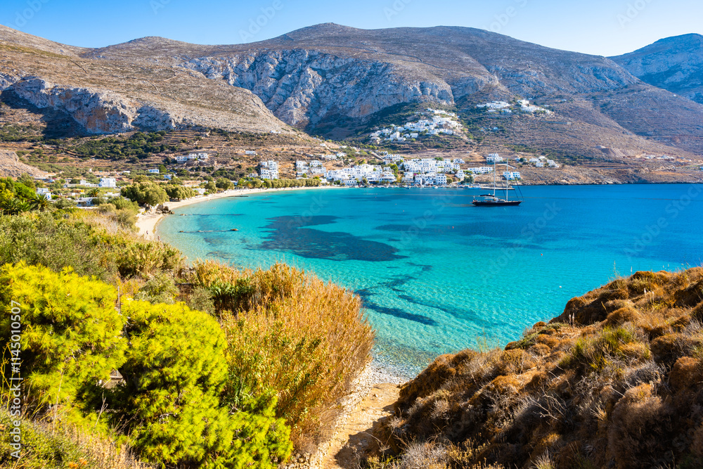 View of idyllic sandy Levrossos beach in Aigiali bay (Ormos Egialis)