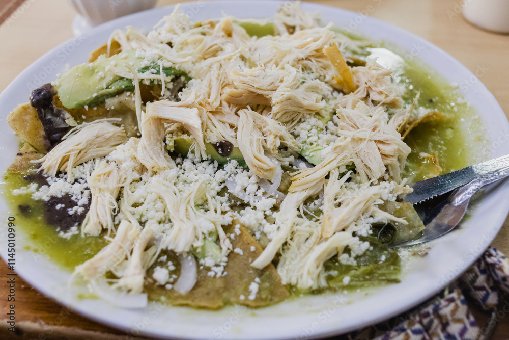 Chilaquiles with green sauce. Authentic breakfast from Mexico Chilaquiles with green sauce. Authentic breakfast from Mexico