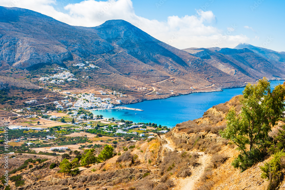 View of trekking path from Tholaria village to Aigiali sea bay and mountains in distance, Amorgos island, Cyclades, Greece