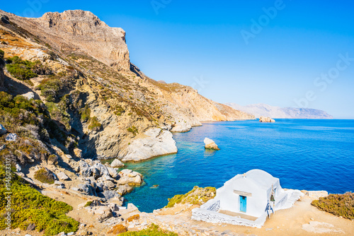 Obraz na płótnie White Greek chapel on rock cliff near Agia Anna beach, Amorgos island, Cyclades, Greece w salonie