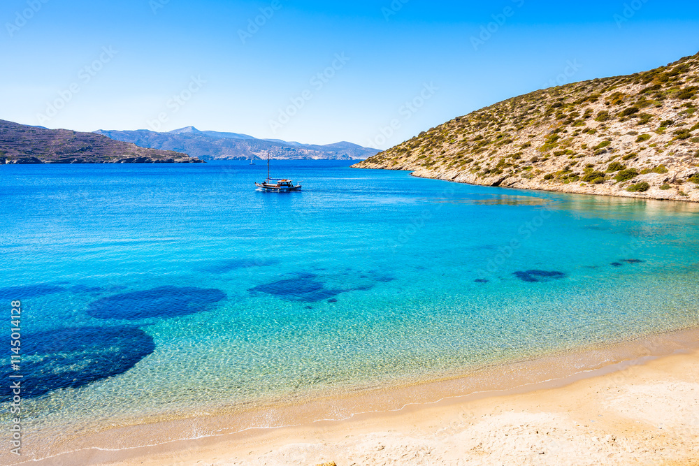 Amazing Maltezi bay and beach with fishing boat on sea, Amorgos island, Cyclades, Greece
