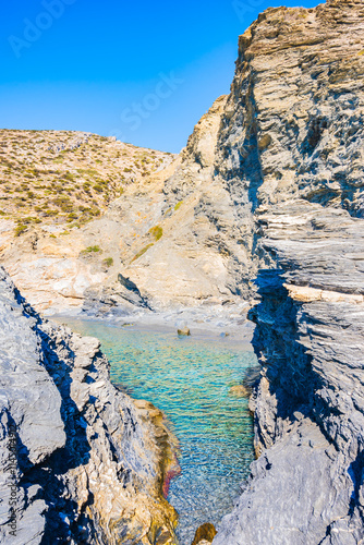 Obraz na płótnie Rocks on Mouros beach with crystal clear azure sea water, Amorgos island, Cyclades, Greece w salonie