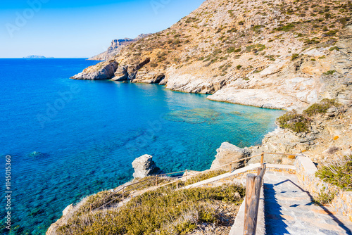 Obraz na płótnie Walking path with steps to Mouros bay and beach with high cliffs and blue sea, Amorgos island, Cyclades, Greece w salonie