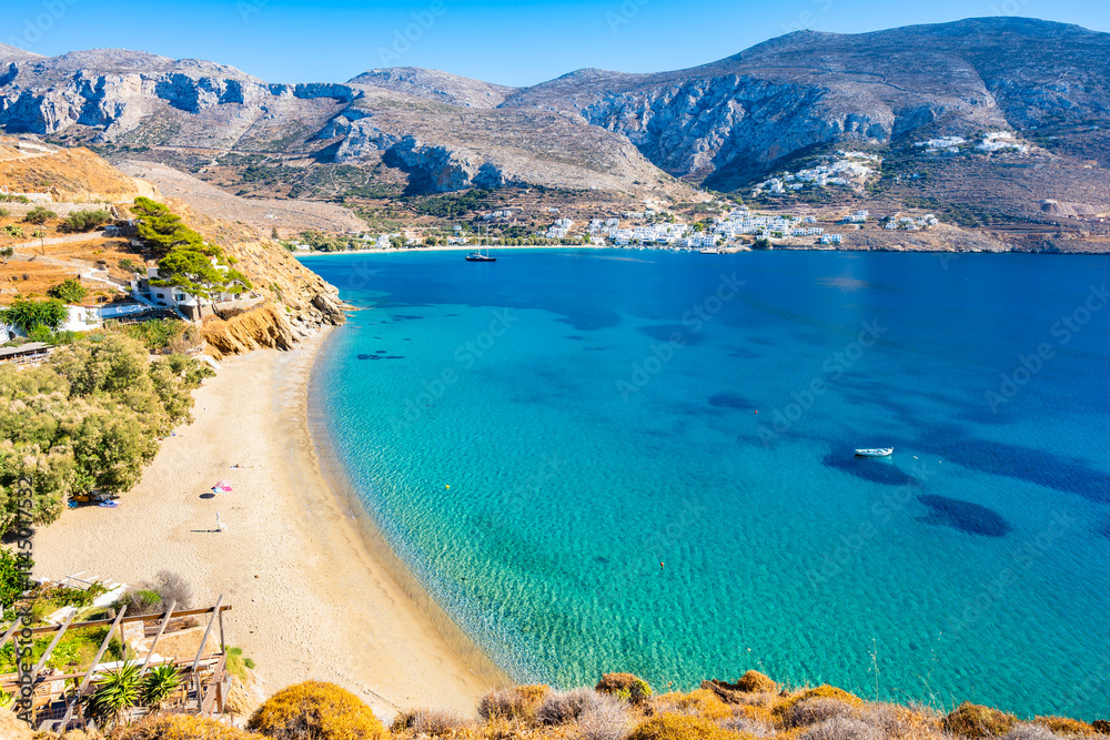 View of idyllic sandy Levrossos beach in Aigiali bay (Ormos Egialis)