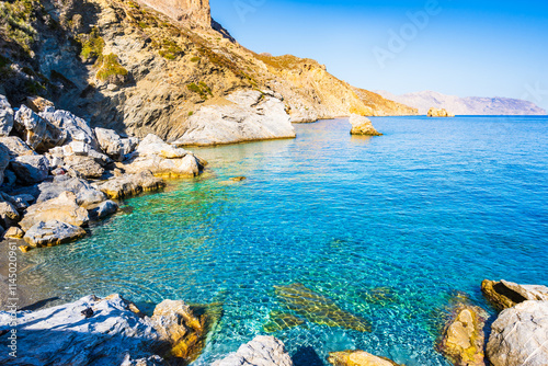 View of Agia Anna beach with high sea cliffs, Amorgos island, Cyclades, Greece