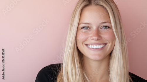 Smiling Blonde Woman with Natural Look Against Soft Pink Background