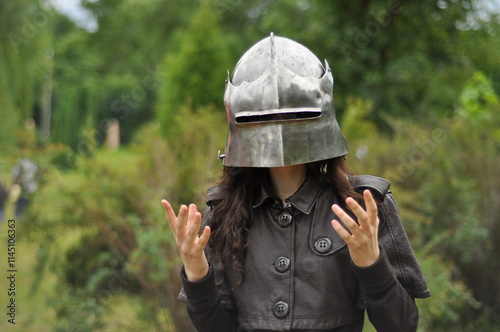 girl in medieval knight helmet 