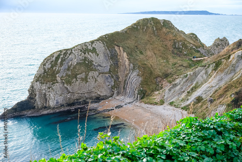 Man O'War Beach next to Durdle Door on Jurassic Coast, Dorset, England, UK. Scenic bay surrounded by Jurassic Coast rocks. Sunny winter days. beautiful landscape and seascape view. English Channel sea photo