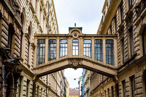 Bridge between buildings designed by Czech architect Osvald Polívka in Nekazanka street seen from Na Prikope, New Town district (Nove Mesto), Prague, Czechia photo