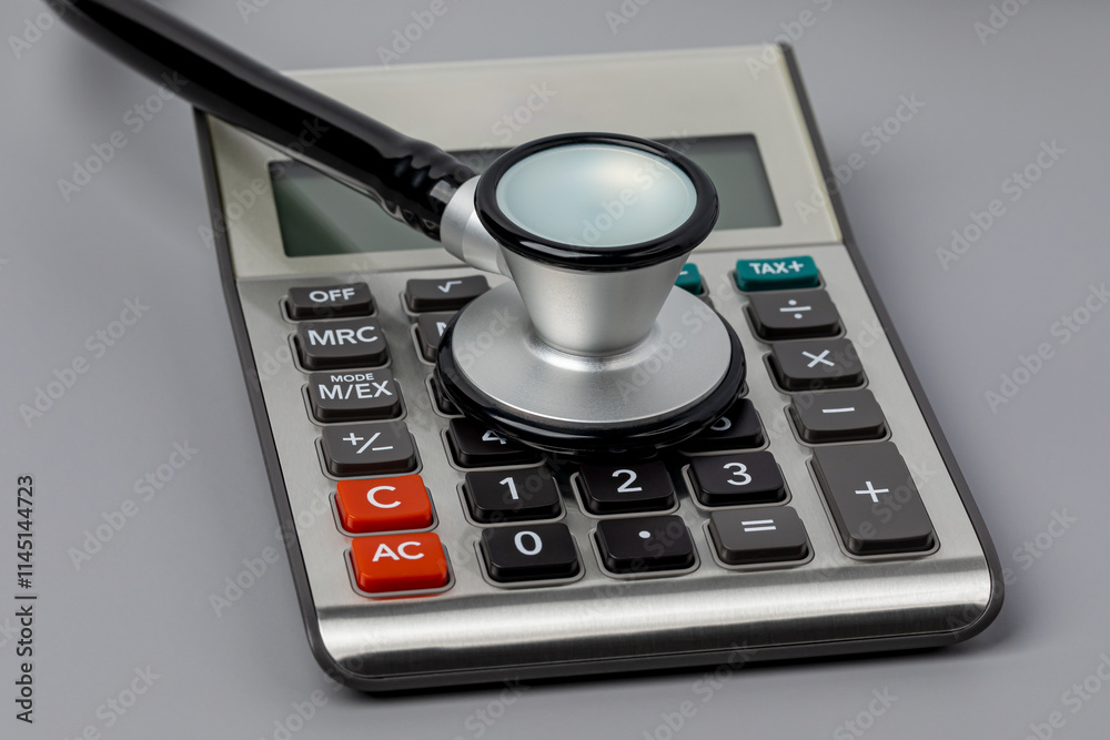 Stethoscope and Calculator. Healthcare, health insurance and medical bills concept. Stethoscope and Calculator. Healthcare, health insurance and medical bills concept.