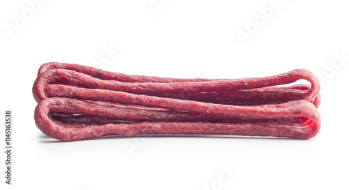 Smoked kabanos. Mini dried thin sausages isolated on white background