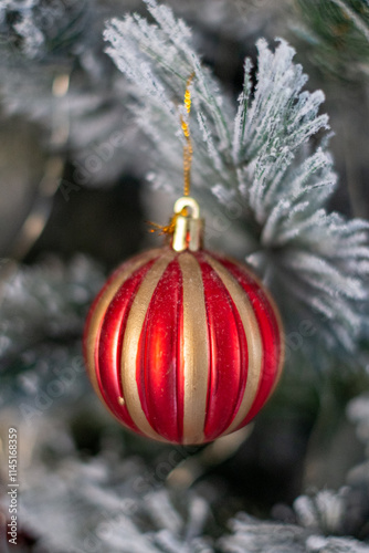 Christmas balls. Colorful balls on the snowy Christmas tree.