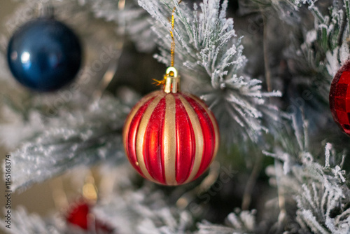 Christmas balls. Colorful balls on the snowy Christmas tree.