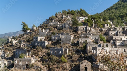Kayakoy ghost town near Fethiye, Mugla, Turkey. Abandoned Greek village with crumbling stone houses, historic ruins, and a hauntingly beautiful hillside setting.