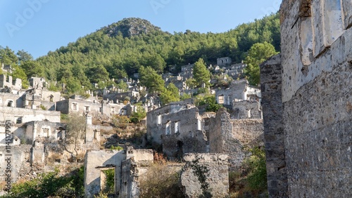 Kayakoy ghost town near Fethiye, Mugla, Turkey. Abandoned Greek village with crumbling stone houses, historic ruins, and a hauntingly beautiful hillside setting.