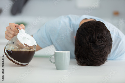 Fotografie sleepy man with a cup of coffee