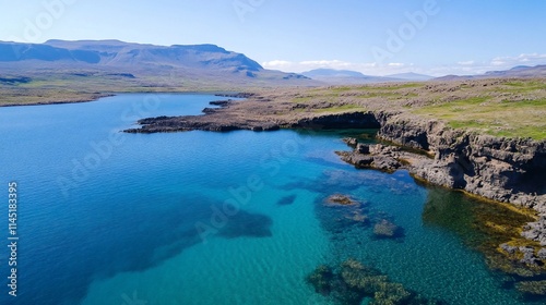 A serene coastal landscape with clear blue waters and rocky cliffs.