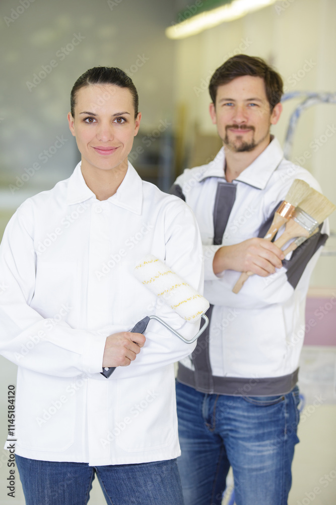 male and female painting and decorating team male and female painting and decorating team